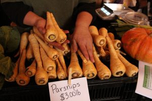 Cheryl Rogowski of Rogowski Farm stocks parsnips this time of year at the Cold Spring Farmers’ Market. Photo by M.A. Ebner 